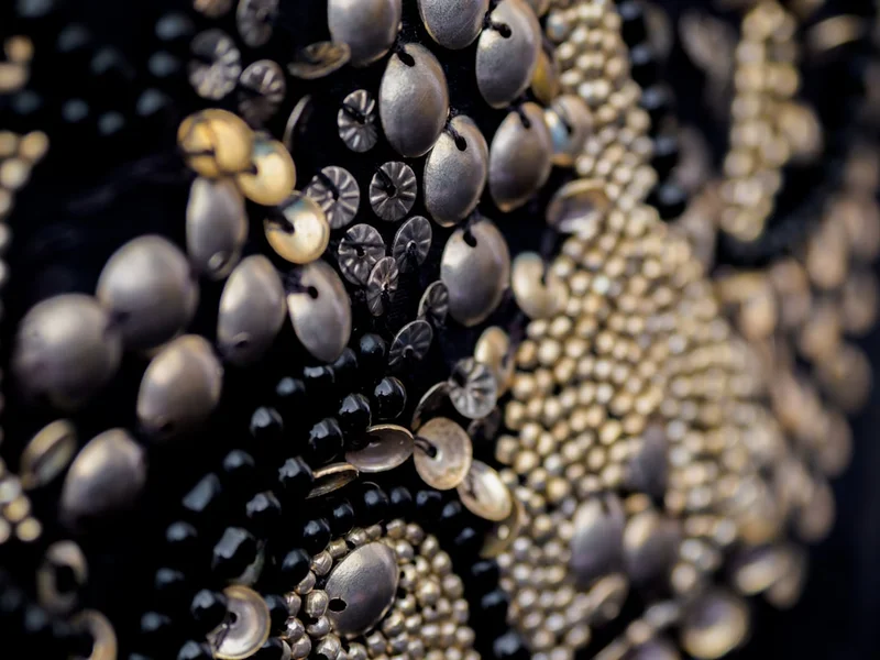 close up, bokeh, macro, blur, blurred background, close focus, fabric, fashion, embellishing, decoration, jacket, clothing, gold, sewing, pearly queen